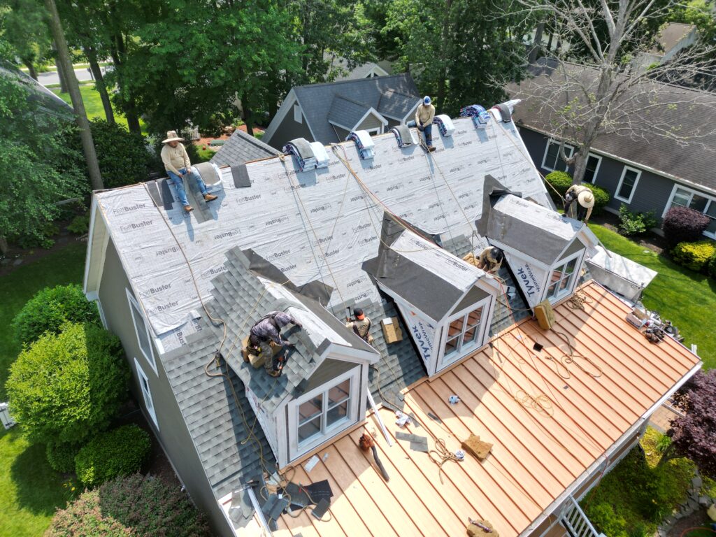 architectural shingles vs 3 tab Grand Exteriors workers replacing shingles